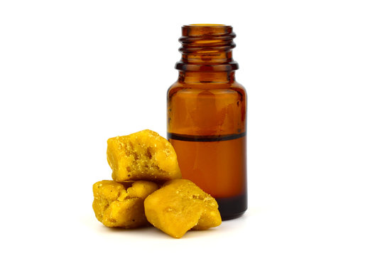 Asafoetida Dried Gum Medicine Tincture in a Bottle, Isolated on White Background. Also Known as Food of the Gods, Devil's Dung, Jowani Badian, Hing, Hengu, Inguva, Kayam, and Ting.