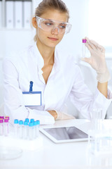 Female scientific researcher or blood test assistant in laboratory. Medicine concept