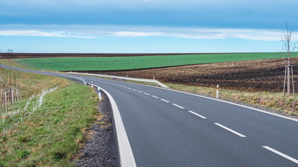 The asphalt quality local road with nice blue sky