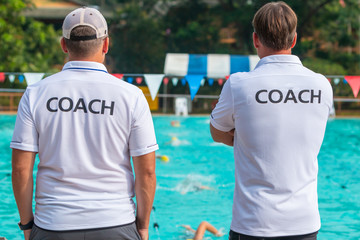 Fototapeta premium Back view of sport coaches