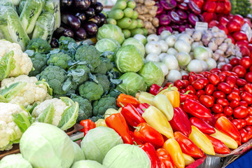 Vegetable farmer market counter. Colorful heap of various fresh organic healthy vegetables at grocery store. Healthy natural food background