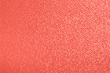 Leather texture background living coral color. Trend color concept of the year.