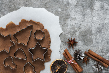 Ingredients for cooking Christmas gingerbread cookies on stone background, top view