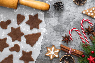 Christmas food. Ingredients for cooking Christmas gingerbread cookies with decorations on stone...