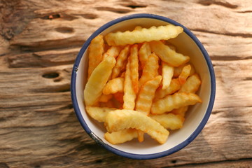 Zoom French Fries in cup on wood