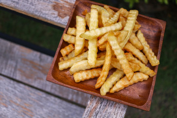 Zoom French Fries in cup on wood