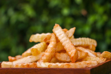 Zoom French Fries in cup on wood