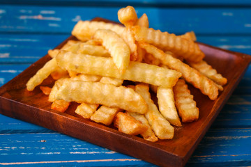 Zoom French Fries in cup on wood