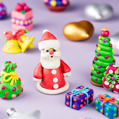 Merry Christmas greeting card with decorations. Santa Claus, Christmas tree and presents close up