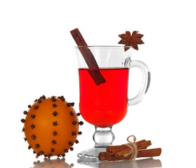 Hot spiced mulled wine and orange flowered carnations isolated