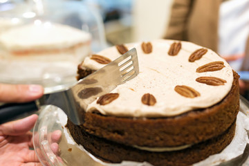 Delicious homemade carrot cake sliced for sharing in the coffee shop.