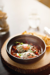 Lunch Time. Fried eggs creative serving on table isolated close-up blurred background