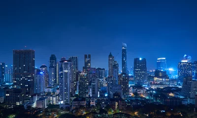 Foto op Canvas Cityscape night panorama view of Bangkok modern office business building and high skyscraper in business district at Bangkok,Thailand. © jamesteohart