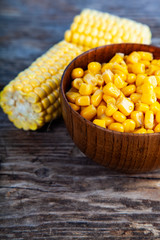 Ripe corn on an old wooden table.