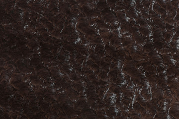 Texture of brown artificial leather (astrakhan).