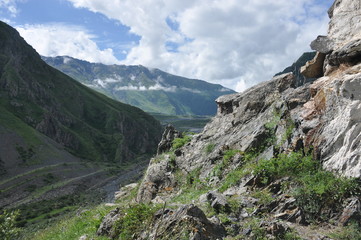 The war road in Georgia. A trail leading through the valley at the foot of Mount Kazbek to the border with Russia.