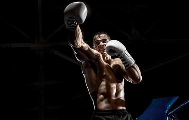Fototapeta na wymiar punching boxer on boxing ring