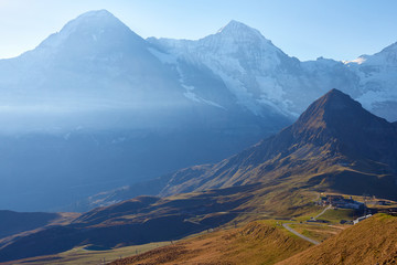 Morning view of Eiger and Monch mountains and Tschuggen peak on foreground in Lauterbrunnen in...
