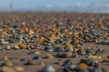 Obraz premium colorful stones over the sand on the beach