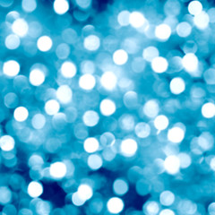 Blue blurred bokeh background,white circles, glitter, holiday