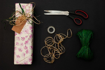 A wrapped up present and the equipment for wrapping