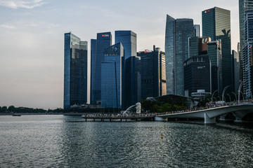 Fototapeta premium Marina Bay Waterfront in Singapore, featuring Marina Bay Sands, lotus-shaped ArtScience Museum and Helix Bridge