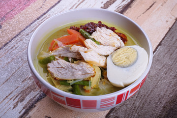 Lontong-Traditional Malaysian and   Indonesian food on wooden table .