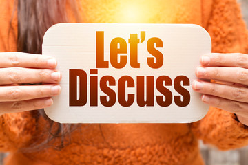 business woman holding white carton  paper with let's discuss text
