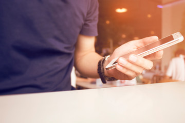 man with smartphone mobile in coffe shop conect to social network technology