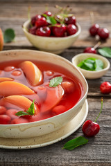 Delicious fruit soup in hot summer garden