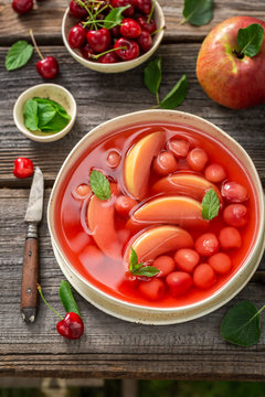 Yummy fruit soup with apples and cherries