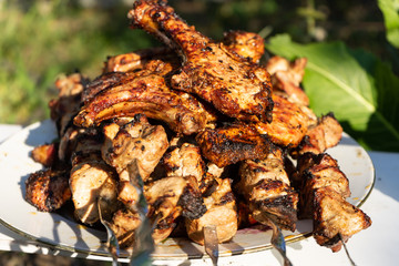 Barbecue on the grill. Ready-made pieces of meat on skewers.