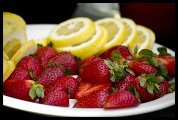strawberries and lemon on a plate