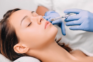woman having lip injection for lip augmentation