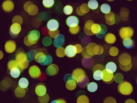 Abstract blurred background of many round blurred yellow lights