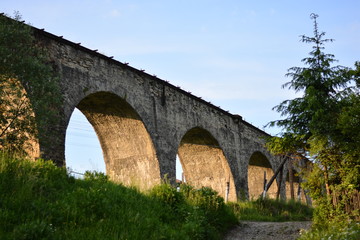 Fototapeta premium bridge, river, architecture, aqueduct, arch, old, stone, ancient, sky, water, roman, viaduct, landscape, travel, spain, building, europe, monument, historic, history, construction, pont, landmark, bri