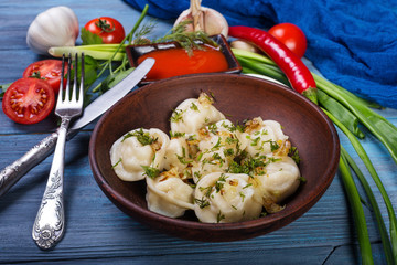 Dumplings in clay plate
