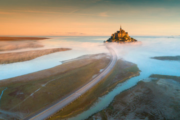 aerial view to road and  castle in sun lights in France