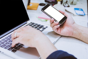 Newsletter concept Hand of businessman or designer checking message box on digital mobile phone,blank white space for your text Vintage tone filter.