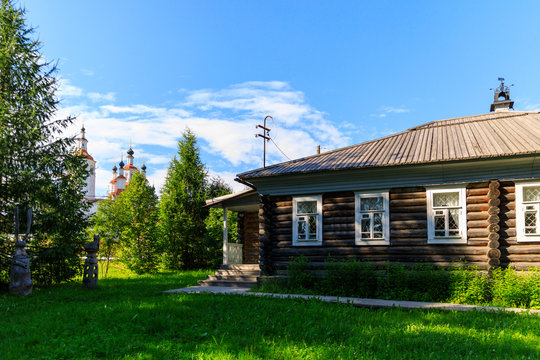 Wooden house withcarved platbands in Totma. Russian traditional architecture lies in wooden houses with manually carved decorations, often painted in white.
