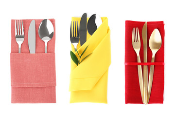 Different napkins with cutlery on white background, top view. Table setting