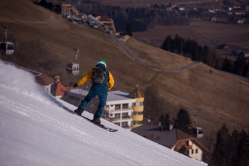snowboarder running down the slope and ride free style