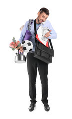 Businessman with lots of things talking on phone against white background. Combining life and work
