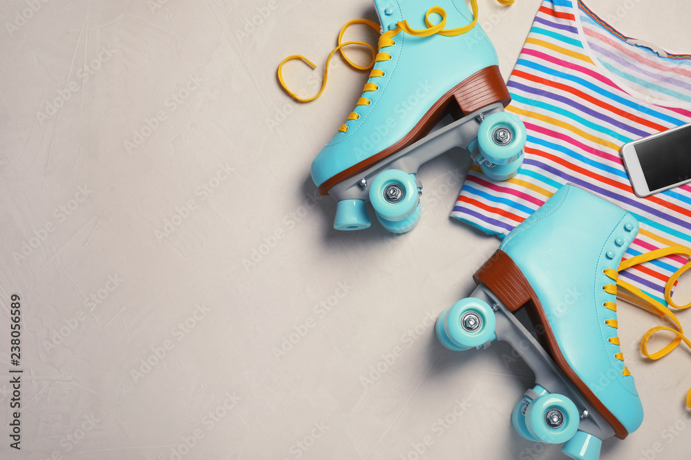 Wall mural flat lay composition with quad roller skates and space for text on light background