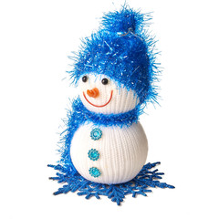 Toy snowman in blue hat and scarf isolated on white background