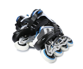 Pair of inline roller skates on white background