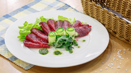Salad with fresh vegetables in a white plate