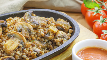 Buckwheat with mushrooms in a pan