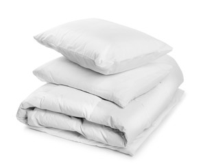 Clean blanket and pillows on white background - obrazy, fototapety, plakaty