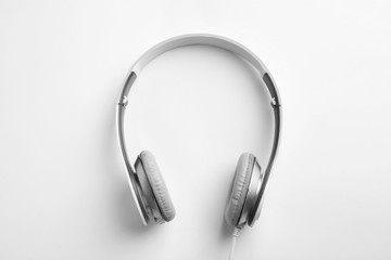 Stylish modern headphones with earmuffs on white background